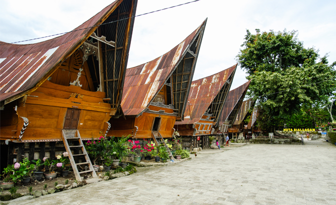 A row of rumah bolon (vernacular wooden houses)
