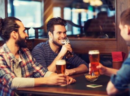 men drinking in pub