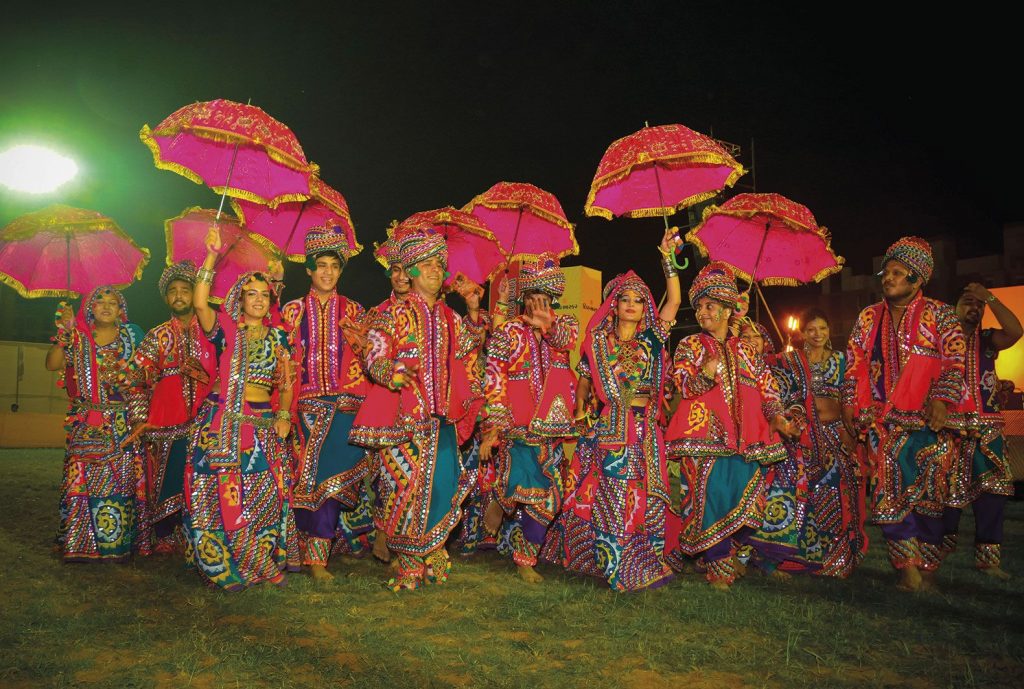 navratri dancers in colourful costumes