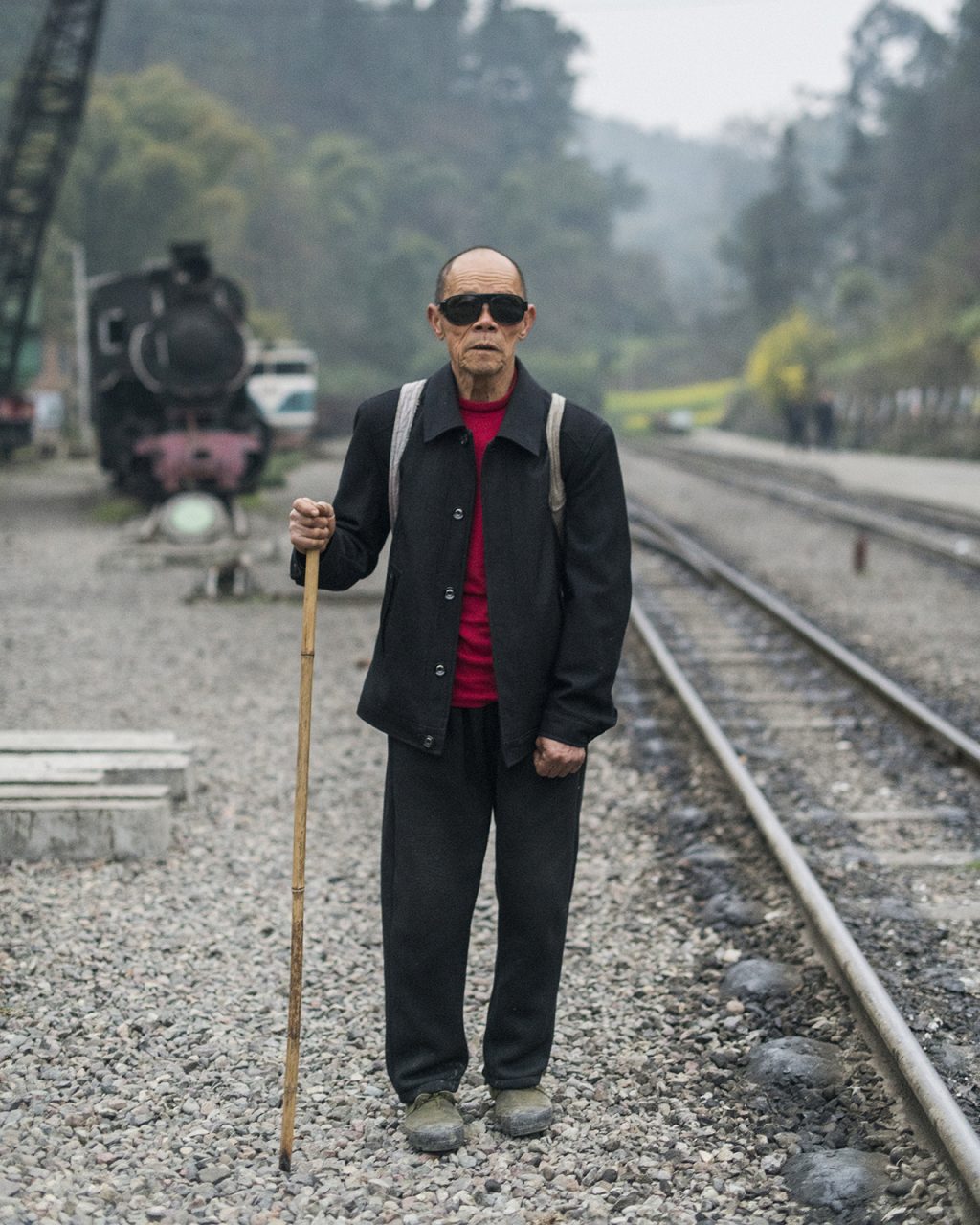 Huang Hongmin, a retired miner, has ridden the steam train for the past half-century