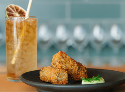 Spicy Whiskey Ginger and croquettes (Photo: Alanna Hale)