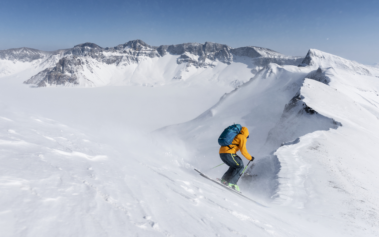 A skier flies down the slopes of Changbai Mountain