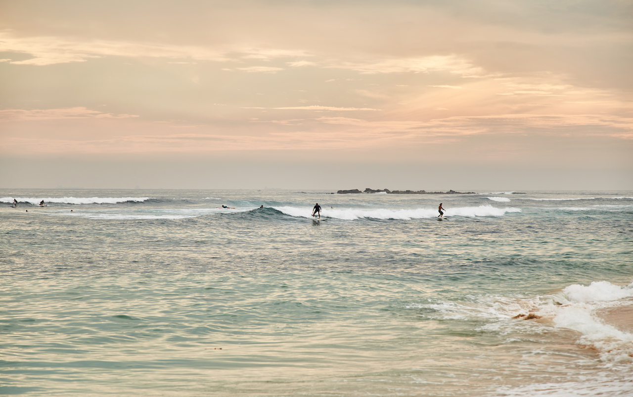 Sunset surfing at Midigama