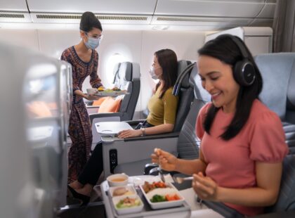 asian eating inside plane