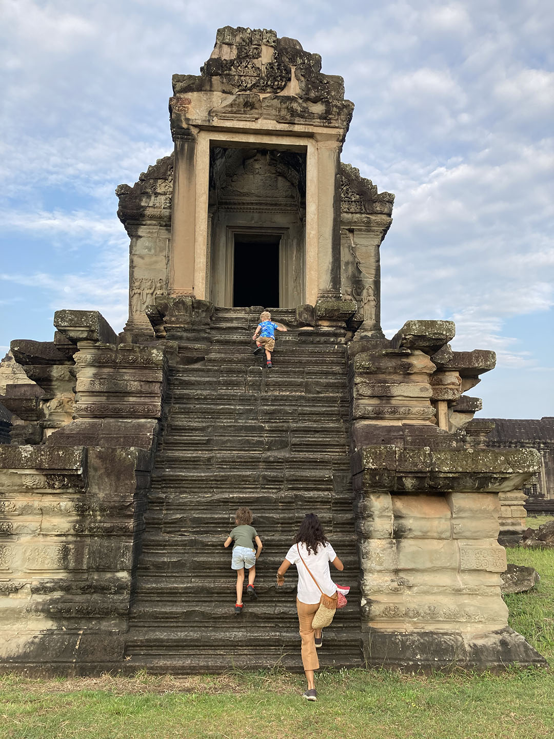 Kids climbing Angkor Wat
